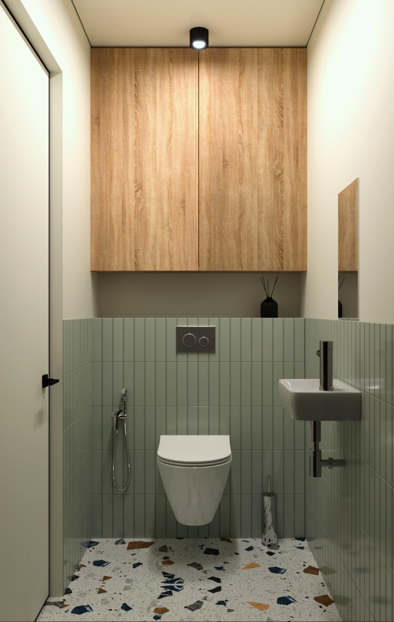 Компактная ванная с терраццо и вертикальной плиткой.